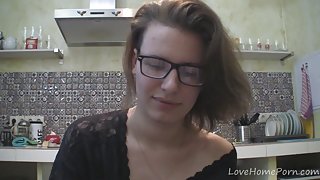 Solo girl with glasses chatting in the kitchen